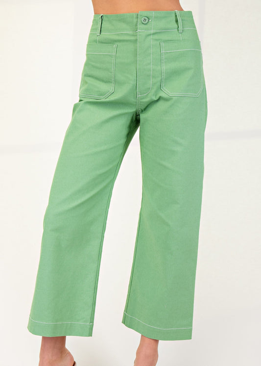 Cheerful apple green wide-leg cotton pants with high-rise waist, handy pockets, and sweet white stitching. Elle Boutique, Zachary, LA.