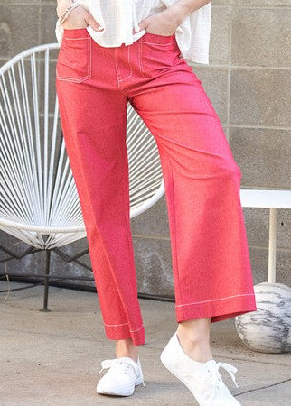 Soaking up sunshine in flowy, cotton blend Sunset Raspberry wide leg pants—high-rise waist, pockets & crisp white sneakers. Elle Boutique, Zachary, LA.