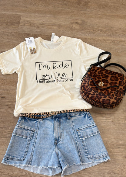 Cozy beige cotton Ride or Die tee with relaxed fit, denim shorts, leopard print belt & purse, gold earrings. Elle Boutique, Zachary, LA.