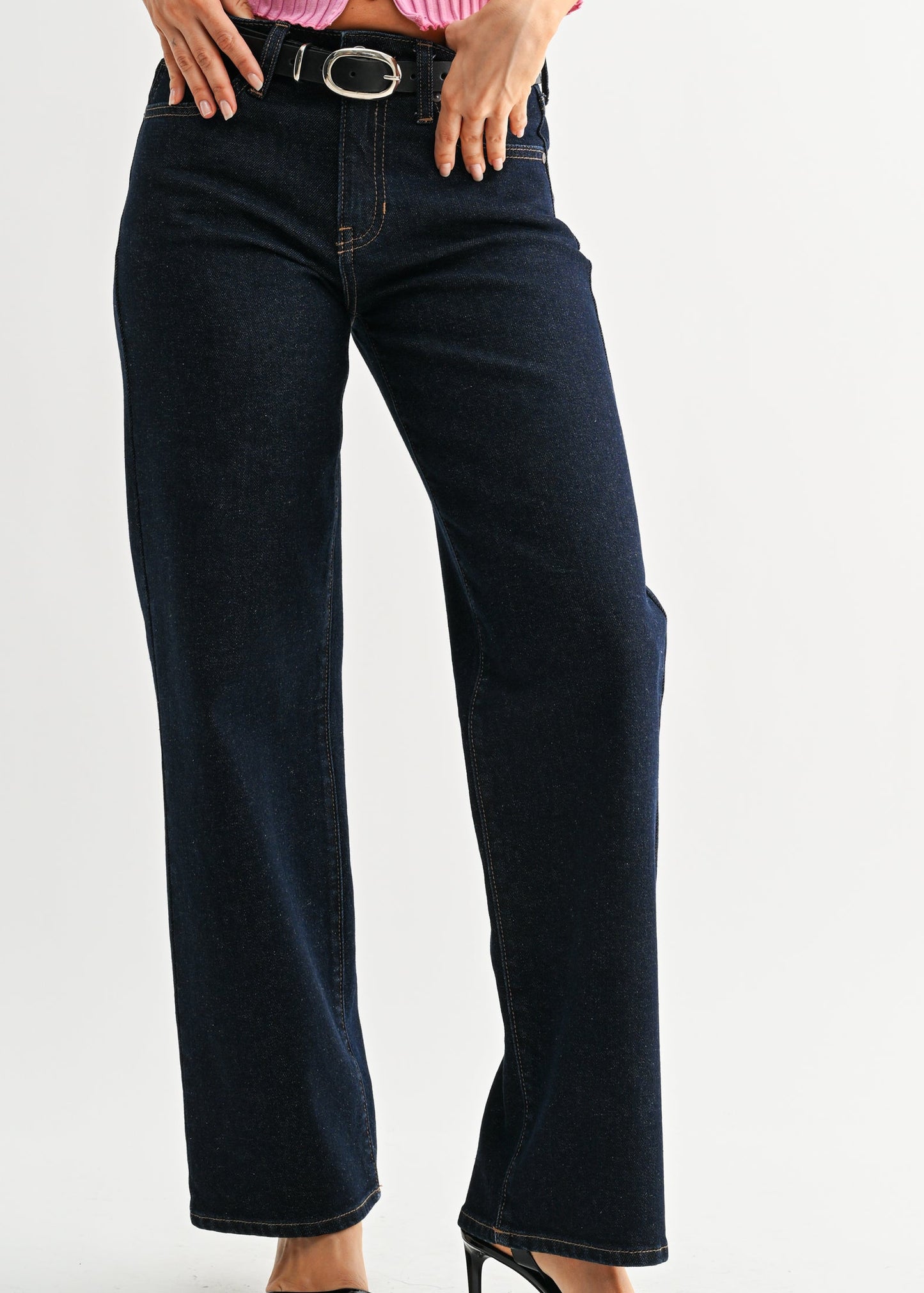 A gal in dark blue, mid-rise Robbie Jeans with a comfy straight fit, chic black belt and heels. Elle Boutique, Zachary, LA.