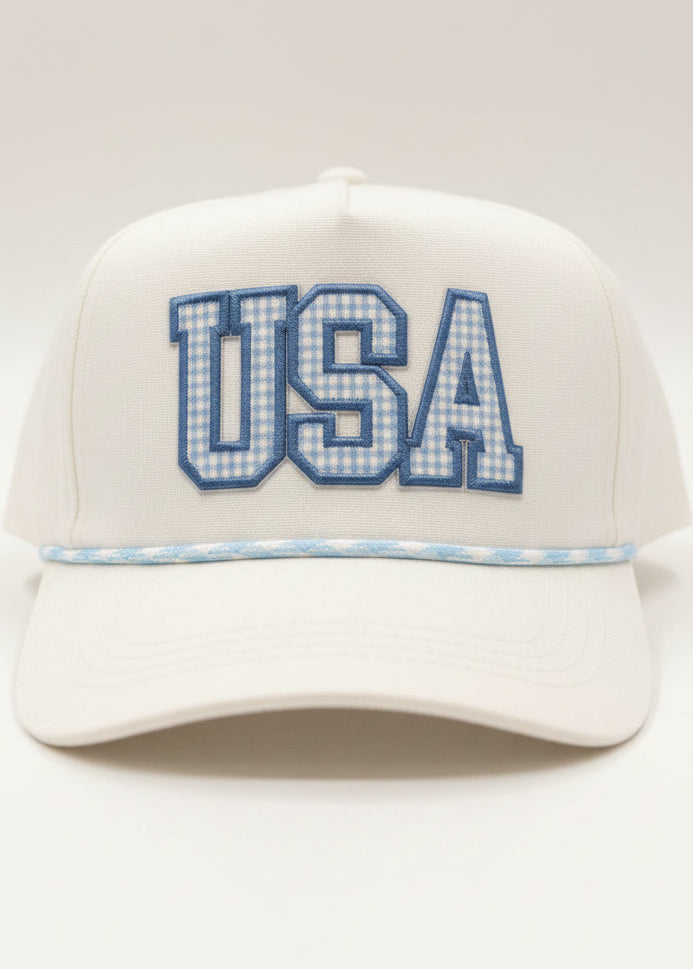 Bring Southern charm to your look with this comfy white cotton USA hat, blue gingham rope & bold embroidery. Elle Boutique, Zachary, LA.