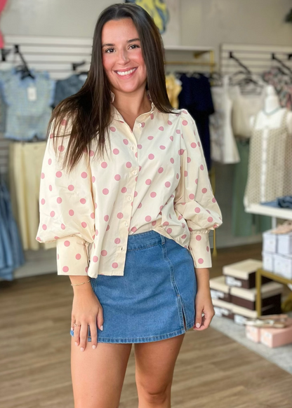 A sweet gal models a soft denim skort with a comfy fit and a beige, pink-spotted blouse. Elle Boutique, Zachary, LA.