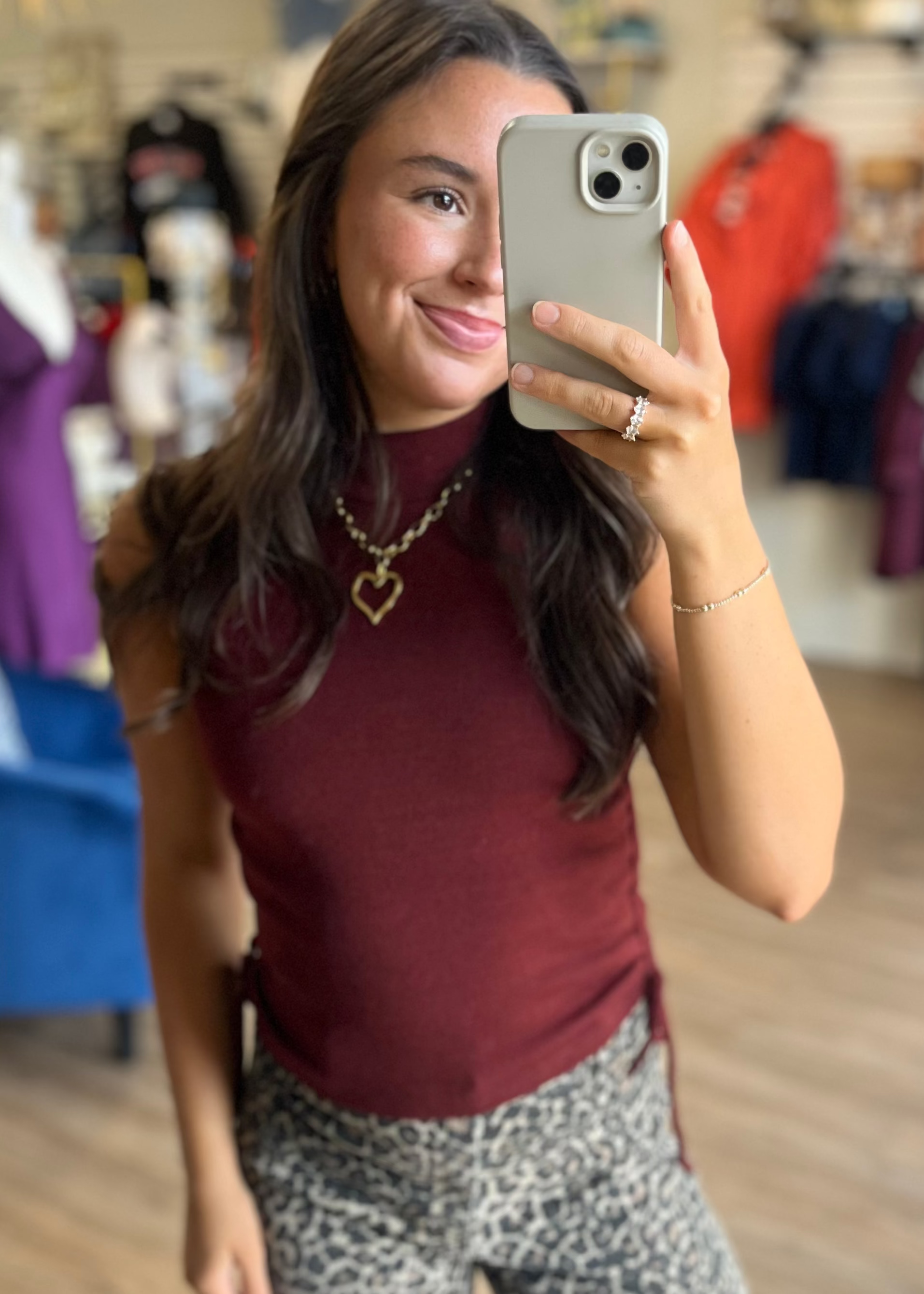 A woman in a soft burgundy Victoria Tank pairs it with leopard print pants and a heart necklace. Elle Boutique, Zachary, LA.