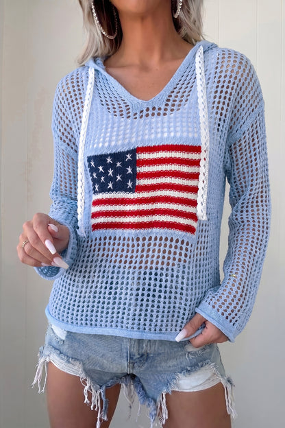 A gal rocks our breezy blue crochet knit flag hoodie with a comfy fit and cute star patches, paired with denim shorts. Elle Boutique, Zachary, LA.
