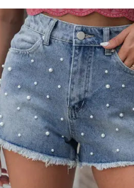 Sweet Southern charm shines in these soft denim shorts, pearl-detailed with raw hems and a pink top. Elle Boutique, Zachary, LA.